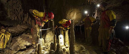 Researchers in a cave